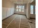 Formal dining room features wainscoting, hardwood floors, and a chandelier at 3730 Reserve Overlook (Lot 8) Way, Cumming, GA 30041