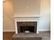 Modern fireplace with brick surround and white mantel at 3730 Reserve Overlook (Lot 8) Way, Cumming, GA 30041