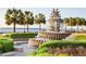 Water fountain in a park with palm trees and waterfront views at 3730 Reserve Overlook (Lot 8) Way, Cumming, GA 30041