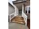 Front entry with stone steps and white railings at 3730 Reserve Overlook (Lot 8) Way, Cumming, GA 30041