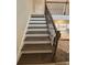 Elegant staircase with dark wood treads and metal railing at 3730 Reserve Overlook (Lot 8) Way, Cumming, GA 30041