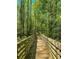 Wooden footbridge in a lush forest setting at 3730 Reserve Overlook (Lot 8) Way, Cumming, GA 30041