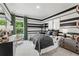 Stylish bedroom with black and white striped walls, comfortable bed, and ample storage at 704 Hedwig Dr Lot 90, Mcdonough, GA 30252