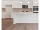 Modern kitchen featuring white cabinets and granite countertops at 704 Hedwig Dr Lot 90, Mcdonough, GA 30252