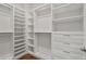 Walk-in closet features custom shelving, drawers and wooden floors at 2517 Canopy Ct, Marietta, GA 30066