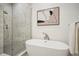 Spa-like bathroom with a soaking tub and a walk-in shower at 675 Drewry Ne St # 205, Atlanta, GA 30306