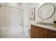 Modern bathroom with a bathtub, toilet and stylish wood vanity at 675 Drewry Ne St # 205, Atlanta, GA 30306