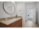 Contemporary bathroom with a vanity, toilet and view into bedroom at 675 Drewry Ne St # 205, Atlanta, GA 30306