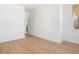 Spacious bedroom with luxury vinyl plank flooring and an adjacent bathroom at 675 Drewry Ne St # 205, Atlanta, GA 30306