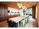 Community room with a long dining table and modern kitchen at 675 Drewry Ne St # 205, Atlanta, GA 30306