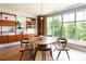 Modern dining area featuring a round table and built-in shelving at 675 Drewry Ne St # 205, Atlanta, GA 30306