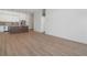 Open living room with modern kitchen and luxury vinyl plank flooring at 675 Drewry Ne St # 205, Atlanta, GA 30306