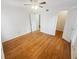 Empty bedroom with hardwood floors, white walls, closet, and natural light from the window at 311 Granville Ct, Atlanta, GA 30328