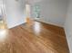 Bedroom with hardwood flooring and a walk-in closet adjacent to the ensuite bathroom at 311 Granville Ct, Atlanta, GA 30328