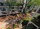 Exterior view of a condominium complex from above with trees, balconies, and outdoor seating at 311 Granville Ct, Atlanta, GA 30328