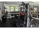 Well-equipped gym with weight machines, free weights, and mirrored wall, promoting a healthy lifestyle at 311 Granville Ct, Atlanta, GA 30328