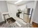 Well-maintained kitchen featuring granite countertops, stainless steel appliances, and white cabinets at 311 Granville Ct, Atlanta, GA 30328