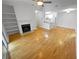 Bright living room with a fireplace, built-in shelving, and an open floor plan leading to the kitchen at 311 Granville Ct, Atlanta, GA 30328