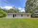 The backyard features a large concrete patio and well maintained lawn at 89 Elsberry Rd, Dallas, GA 30157