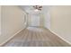 Bedroom with plush carpeting, a ceiling fan, ample closet space, and two windows for natural light at 89 Elsberry Rd, Dallas, GA 30157