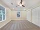Comfortable bedroom with new carpet, a ceiling fan, ample closet space and natural light at 89 Elsberry Rd, Dallas, GA 30157