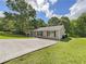 Charming single-story home with a well-manicured lawn and a long driveway leading to a covered front porch at 89 Elsberry Rd, Dallas, GA 30157