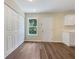 Versatile room with lots of closet storage, wood look flooring, and a single door to the outside at 89 Elsberry Rd, Dallas, GA 30157