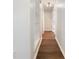 Hallway with built-in shelving and hardwood flooring leading to other rooms at 89 Elsberry Rd, Dallas, GA 30157