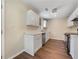 Modern kitchen with white cabinets, stainless steel appliances, and hardwood flooring at 89 Elsberry Rd, Dallas, GA 30157