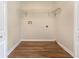 Dedicated laundry space featuring hardwood floors and a wire rack for storage at 89 Elsberry Rd, Dallas, GA 30157