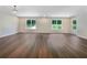 Bright open living area featuring hardwood floors and large windows offering plenty of natural light at 89 Elsberry Rd, Dallas, GA 30157