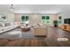 Bright living room with hardwood floors, large windows, and modern furniture at 89 Elsberry Rd, Dallas, GA 30157