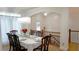 Formal dining room with chandelier, table setting and hardwood floors at 10785 Arlington Pt, Alpharetta, GA 30022