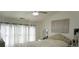 Large main bedroom with high ceilings and plenty of natural light at 10785 Arlington Pt, Alpharetta, GA 30022