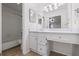 Bright bathroom features a white vanity with drawers and cabinet space, plus a tub and shower combination at 707 Augusta Se Dr, Marietta, GA 30067