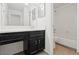 Bright bathroom features a dark vanity with drawers and cabinet space, plus a tub and shower combination at 707 Augusta Se Dr, Marietta, GA 30067