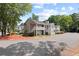 Condo building featuring lush landscaping and ample parking space for residents and visitors at 707 Augusta Se Dr, Marietta, GA 30067