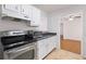 Bright kitchen featuring stainless steel appliances, and view to the dining room at 707 Augusta Se Dr, Marietta, GA 30067