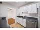 Well-lit kitchen featuring a stainless steel dishwasher and ample counter space at 707 Augusta Se Dr, Marietta, GA 30067