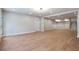 Finished basement featuring hardwood floors and stairs at 145 Cedarwood Ln, Roswell, GA 30075