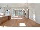 Open concept dining room with hardwood floors and modern chandelier at 145 Cedarwood Ln, Roswell, GA 30075