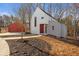 Modern farmhouse design with attached garage and spacious yard at 145 Cedarwood Ln, Roswell, GA 30075