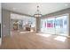 Open concept living room with hardwood floors and chandelier at 145 Cedarwood Ln, Roswell, GA 30075