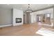 Open living room with hardwood floors and fireplace at 145 Cedarwood Ln, Roswell, GA 30075