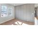 Bright home office with light hardwood floors and gray board and batten wall at 145 Cedarwood Ln, Roswell, GA 30075