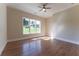 Spacious bedroom with hardwood floors and a view at 971 Heathchase Dr, Suwanee, GA 30024