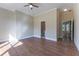 Hardwood floor bedroom with access to bathroom and other rooms at 971 Heathchase Dr, Suwanee, GA 30024