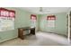Charming bedroom with neutral walls, carpet flooring, and a built-in desk at 5622 Williamsburg Dr, Norcross, GA 30093
