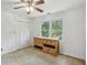 Well-lit bedroom with built-in dresser and ceiling fan at 5622 Williamsburg Dr, Norcross, GA 30093