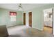 Spacious bedroom with neutral walls, carpet flooring and an ensuite bathroom at 5622 Williamsburg Dr, Norcross, GA 30093